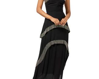 146 Chloe: A Black Silk Beaded Evening Gown Circa 1980s, France Labels: Chloé / Made in France; Made especially for Neiman Marcus A long strapless bustier silk crepe dress featuring a fitted bodice above a three layer skirt with two floaty shaped tiers, the dress edges embellished with wide bands of silvered bugle beads, with a back zip, and silk lining to bodice  No size label: bust across front: 19 in.; waist: 14 in.; hips: 19 in.; CB length: 50 in. Estimate: $300 - $500