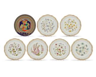 426 A set of eleven Spode porcelain 'Wildflower Series' plates Mid/late 20th century Each Spode with gilt factory marks, labeled for depicted flower, and signed: D. Emery [Dennis Emery]; Wiinblad with Rosenthal factory marks, signed, and inscribed: "Heilige 3 Könige" Melchoir; additionally signed, dated, and titled to front: 1973 / Weinachten Each Spode housed in original padded box, with gilt trim and depicting various flowers including: no. 1 Harebell Y8246-A (2), no. 2 Buttercup Y8247-A (2), no. 3 Meadow Cranesbill Y8248-A (1), no. 4 Viola Y8253-A (2), no 5. Foxglove Y8254-A (2), no. 6 Love-in-a-Mist Y8255-A (2) Together with a Rosenthal & Bjorn Wiinblad (1819-2006) porcelain Christmas plate 12 pieces total Each Spode: 11" Dia.; Each box: 1.625" H x 12.25" W x 12.25" D; Wiinblad: 11.375" Dia. Estimate: $100 - $200