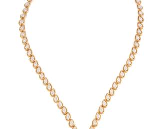 79 Oscar Heyman & Brothers for Cartier: An 18K Gold, Platinum, and Diamond Necklace, 1977 Featuring sixty-nine graduated pear-shaped diamonds weighing approximately 22.15 carats, set in a draping 'V' shaped design, Oscar Heyman maker's mark 85778, c.1977, signed Cartier 1257, with certificate of authenticity  Measures: 22 in. 55.9 grams Estimate: $20,000 - $30,000
