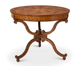 323 A Continental specimen wood center table Early 19th century The top inlaid with central medallion of fleur-de-lis and geometric repeating motifs, raised on three scroll legs, resting on ball feet 30" H x 36" Dia. Estimate: $400 - $600