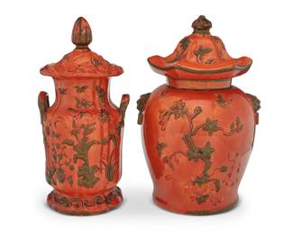 244 Two English glazed earthenware covered jars 19th century Each relief decorated in the chinoiserie taste with floral motifs against an orange ground 2 pieces Lager: 16" H x 10.25" W x 10" D; Smaller: 15.75" H x 7.5" W x 7" D Estimate: $300 - $500