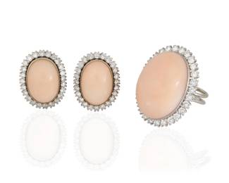 19 An 18K White Gold, Coral and Diamond Ring and Earring Set Centering three oval coral cabochons, encircled by round diamonds weighing approximately 3.88 carats total 3 pieces  Ring: 7 1/4, Earrings: 7/8 x 1/2 in. 36.4 grams gross Estimate: $3,000 - $5,000