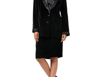 160 Margaretha Ley for Escada: A Black Velvet & Satin 'Rock Kombi' Skirt Suit Circa 1980s-1990s, Germany Label: Escada / Margaretha Ley / Made in Germany A two-piece tuxedo style black cotton velvet suit comprising a fitted blazer with silk/wool satin ruffled lapels and cuffs, front pockets, and a branded viscose lining, together with a matching straight skirt with satin waistband and vertical tuxedo stripes to side seams 2 pieces  Jacket: size 42/US 12: bust across front: 20 in.; waist: 19.5 in.; sleeves: 26 in.; across back shoulders: 17 in.; CB length: 28 1/2 in. Skirt: size 44/US 14: waist across front: 16 in.; hips: 21 in.; CB length: 26 in. Estimate: $200 - $300