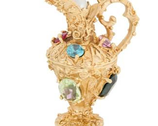 89 A 14K Gold and Gem-Set Charm Of an antique pitcher design featuring oval and round multi-colored synthetic stones  Measures: 1 1/2 x 1 1/2 in. 16.5 grams gross Estimate: $700 - $1,000