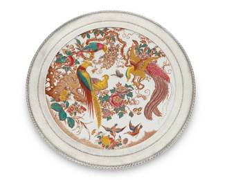 266 A sterling silver mounted Royal Crown Derby porcelain 'Olde Avesbury' plate 1952 with later elements The porcelain dated with factory marks: XV; silver marked: STERLING Transfer printed and hand-colored, depicting birds of paradise, later clad in repoussé sterling 1.625" H x 13.125" Dia. Estimate: $100 - $200