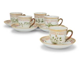 411 A set of twelve Royal Copenhagen porcelain 'Flora Danica' tea cups and saucers Date codes for 1963-74 Each with green printed factory mark above underglaze blue wave and green painted pattern 20 over shape number 3597, black painted titles in Latin 12 pieces Each cup: 2.625" H; Each saucer: 5.5" Dia. Estimate: $2,500 - $3,500