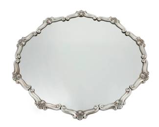 259 A Peruvian sterling silver mounted mirrored plateau Mid-20th century Marked: Plata 925 Del Pilar Peru / RI 8357 With scrolls and foliate motifs to rim and a wood backing 1.125" H x 22.25" W x 19.25" D Estimate: $500 - $700
