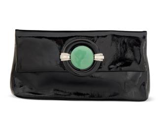136 Kenneth Jay Lane: A Vintage Black Patent Leather Clutch Signed to interior plaque: Kenneth J. Lane A narrow envelope clutch bag with green and black Art Deco-style resin magnetic clasp with diamonté accents, with zip closure and matching compact mirror 2 pieces  5 in. H x 10 in. W x 1 1/4 in. D Estimate: $100 - $200