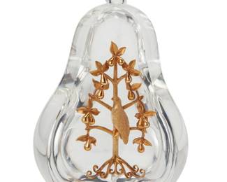 378 A Steuben glass and 18k gold 'Partridge in a Pear Tree' paperweight Late 20th/early 21st century Designed 1970 by Lloyd Atkins (1922-2002), model 1014 Etched to underside: Steuben Housed in original fitted leather-clad box Pear: 5.5" H x 3.75" W x 3.125" D; Box: 5.75" H x 7.75" W x 7.75" D Estimate: $2,000 - $3,000