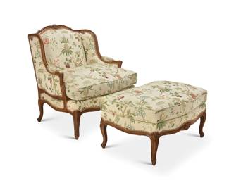 316 A Louis XV style carved fruitwood duchesse brisée 20th century Each piece of the chair and ottoman carved with floral accents, with scrolled armrest terminals and front feet, upholstered in a cotton fabric with cording, embroidered with fruit tree branches 2 pieces Chair: 38" H x 36" W x 32" D; Ottoman: 20" H x 37" W x 26" D Estimate: $500 - $700