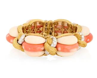 14 An 18K Gold, Coral and Diamond Bracelet Featuring domed graduated carved coral elements, accented by knotted textured gold set with round diamonds weighing approximately 7.25 carats, with French assay marks and makers mark WF  Measures: 6 3/4 in. 175.4 grams gross Estimate: $5,000 - $7,000