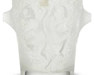 386 A Lalique glass 'Bacchantes' ice bucket Late 20th/early 21st century Etched: Lalique ® / France; with partial factory label 9.125" H x 10" W x 9.25" Dia. Estimate: $800 - $1,200