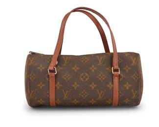 166 Louis Vuitton: A Vintage Monogram Canvas Papillon 26 Bag Circa 1970s-1980s The LV canvas small barrel bag with dual classic russet orange leather handles, zip top closure with Eclair zipper, and with pale russet leather lining to interior  5 in. Dia. x 10 in.; drop: 4 in. Estimate: $300 - $500