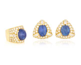 82 An 18K Gold, Tanzanite, and Diamond Ring and Earring Set Featuring three oval tanzanite cabochons, accented by round, baguette and trilliant-cut diamonds weighing approximately 6.45 carats total 3 pieces  Ring: 8, Earrings: 7/8 x 7/8 in. 41.7 grams gross Estimate: $3,500 - $5,500