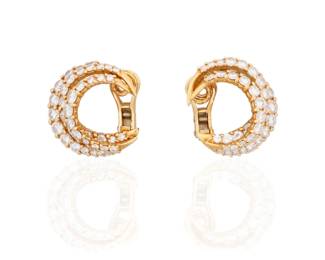 7 A Pair of 18K Gold and Diamond Earclips Of a crescent design featuring three rows of graduated round diamonds weighing approximately 5.92 carats 2 pieces  Measures: 7/8 x 3/4 in. 14.6 grams gross Estimate: $1,800 - $2,500