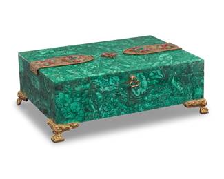 363 A 'jeweled' malachite jewelry box 20th century The hinged lid mounted with dyed stones and metal wire filigree, raised on gilt-bronze feet 5.25" H x 14.75" W x 10.75" D Estimate: $700 - $900