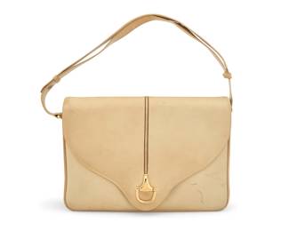 165 Gucci: A Vintage Single 'Horsebit' Beige Leather Handbag Circa 1970s, Italy Marked to interior: Gucci / Made in Italy; number: 22.01.2116 A multi-compartment envelope flap pocketbook shoulder bag with a single gold-tone horse bit motif to clasp, welted detail to flap and edges, gold-toned hardware, adjustable leather strap, and with tonal suede lining  7 1/2 in. H x 10 3/4 in. W x 1 3/4 in. D; drop: 7 1/2 in. to 15 in. Estimate: $400 - $600