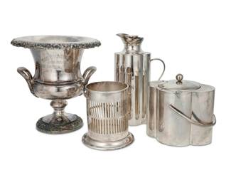 187 Four silver plated bar articles 20th century Pitcher and ice bucket each marked: Mazzuccon / Firenze; wine bucket marked: EGW&S / IS / International Silver / 10/15; coaster marked: Finnigans / Manchester / 6456 Comprising an Italian pitcher and handled ice bucket with lid and glass liner, a footed wine bucket with grape vine motifs in relief, and a wine bottle coaster 4 pieces Pitcher: 11.25" H x 6.25" W x 3.625" D; Bucket: 10.875" H x 10.375" Dia. Estimate: $100 - $200