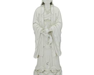 437 A Chinese Dehua style porcelain figure of Guanyin 20th century With impressed marks verso The blanc de chine figure depicted on a double lotus base 26.75" H x 7.5" W x 7.5" D Estimate: $300 - $500