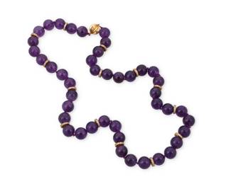 46 A Gold and Amethyst Necklace Of a single strand design featuring round amethyst beads measuring approximately 13.14 mm, accented by gold rondelles set with round diamonds weighing approximately 4.20 carats, finished with a textured gold clasp  Length: 20 in. 153.2 grams gross Estimate: $1,500 - $2,000