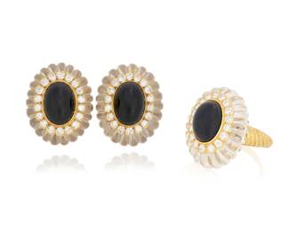 73 An 18K Gold, Onyx, Rock Crystal Quartz and Diamond Ring and Earring Set Featuring carved fluted rock crystal quartz, centering oval onyx cabochons accented by round diamonds weighing approximately 2.16 carats total, stamped DM with English hallmarks 3 pieces  Ring: 8 3/4, Earrings:1 x 3/4 in. 47.5 grams gross Estimate: $3,000 - $5,000