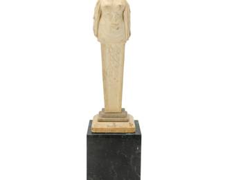 239 A Continental carved marble herm of a maiden 18th/19th century Raised on a later marble plinth 2 pieces Marble with tiered base: 38.5" H x 11" W x 10.5" D; Plinth: 21" H x 14.75" W x 14.75" D Estimate: $2,000 - $3,000