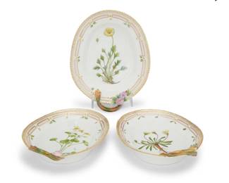 416 Three Royal Copenhagen porcelain 'Flora Danica' pickle dishes Date codes for 1968-74 Each with green printed factory mark above underglaze blue wave and green painted pattern 20 over shape number 3540 or 3541, black painted titles in Latin Comprising a pair and a larger single, each with branch handle 3 pieces Including handles, largest: 9.75" W; Smallest: 9" W Estimate: $1,000 - $1,500
