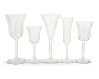 315 A suite of Baccarat glass 'Malmaison' stemware Late 20th/early 21st century Designed 1910 Each etched with factory mark Comprising: 16 tall water goblets (8") 18 claret wine glasses (6.875") 13 champagne glasses (8") 10 fluted champagne glasses (7.5") 13 port wine glasses (6.125") 70 pieces Estimate: $800 - $1,200