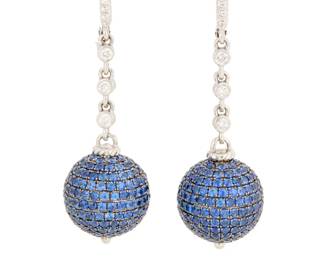 41 A Pair of 18K White Gold, Sapphire and Diamond Earrings Suspending two spheres set with rows of round sapphires accented by a diamond chain set with round diamonds weighing approximately 0.45 carat total 2 pieces  Measures: 1 1/2 in. 14.9 grams gross Estimate: $1,200 - $1,800