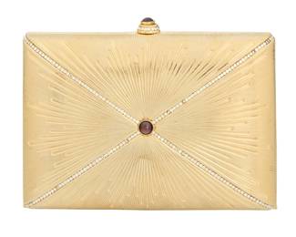 131 Judith Leiber: A Gold Tone Brass & Crystal 'Pillow' Minaudière Marked to interior plaque: Judith Leiber / © A rectangular gilt brass rounded box clutch bag with incised starburst with channel set crystals and set red garnet cabochon accents, with gold-toned hardware, drop-in chain strap, gold leather lining and matching coin purse as well as a gold compact mirror and gold comb with tassel  4 1/4 in. H x 6 1/4 in. W x 1 1/2 in. D; chain drop: 19 3/4 in. Estimate: $400 - $600