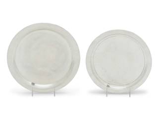 189 Two American sterling silver circular trays 20th century Each impressed: STERLING; one marked for Towle and numbered: 150; the other marked for Watson Company and numbered: K12 2 pieces Larger: 12.125" Dia.; Smaller: 10.625" Dia. Total weight: 30 oz. troy approximately Estimate: $1,000 - $1,500