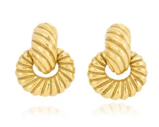 119 David Webb: A Pair of 18K Gold Earclips Featuring interlocking ovals of textured gold in a door knocker style design, signed Webb 2 pieces  Measuring: 1 1/2 x 1 in. 39.4 grams gross Estimate: $5,000 - $7,000