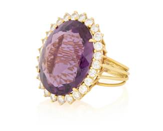 95 A Gold, Amethyst and Diamond Ring Centering an oval amethyst weighing approximately 32.00 carats encircled by round diamonds weighing approximately 2.60 carats  Size: 8 1/4 15.5 grams gross Estimate: $2,000 - $3,000