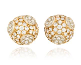 12 A Pair of Bi-Color Gold and Diamond Earclips Of a dome design featuring white and yellow gold set with round diamonds weighing approximately 7.00 carats 2 pieces  Measures: 3/4 in. 17.0 grams gross Estimate: $1,500 - $2,000