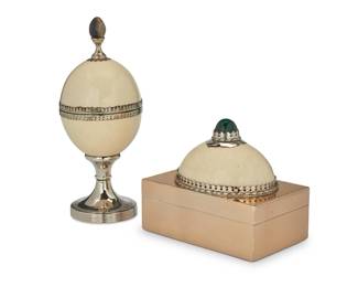 222 Anthony Redmile (1940-2016) Two ostrich egg and silver plated metal boxes, circa 1980s Box impressed: j antony redmile Comprising a rectangular box with wood-lined interior, mounted with a half egg and malachite finial, and an egg box with hardstone finial, raised on a pedestal base 2 pieces Rectangular: 6.875" H x 8.125" W x 5.25" D; Full egg: 12.125" H x 5" Dia. Estimate: $800 - $1,200