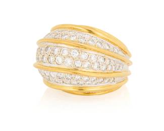 80 An 18K Bi-Color Gold and Diamond Ring Of a domed design featuring five sections of round diamonds weighing approximately 3.40 carats  Size: 6 27.5 grams gross Estimate: $3,000 - $5,000