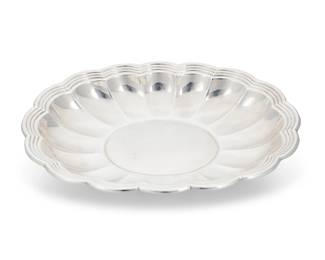 283 An Italian sterling silver vase Late 20th century Impressed: ITALY / St [within an oval] / STERLING / .925 [within an oval] / BATTUTO A MANO Of flared outline with undulating rim 10" H x 7.125" W x 5.125" D 25 oz. troy approximately Estimate: $800 - $1,200