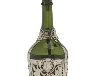 186 An English Arts & Crafts silver mounted glass decanter Late 19th century Unmarked, XRF tested for .990 silver 12.5" H x 4.875" Dia. Estimate: $200 - $300