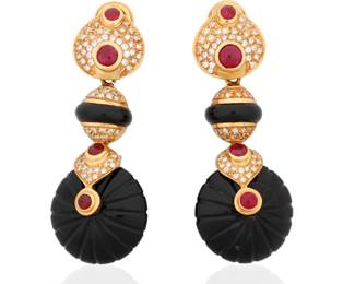 23 A Pair of 18K Gold, Onyx, Ruby and Diamond Earclips Of a pendant design featuring carved onyx, accented by round ruby cabochons and finished with round diamond accents weighing approximately 1.50 carats total 2 pieces  Measures: 2 1/4 x 7/8 in. 36.1 grams gross Estimate: $2,000 - $3,000