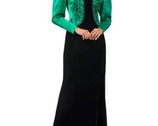 137 Givenchy: A Black Velvet & Green Silk Satin Evening Dress Circa: 1980s, France Label: Givenchy / Nouvelle Boutique / Paris; with boutique label for fabric, style, and size A long fitted dress featuring a green silk satin mock 'jacket' bodice attached to a heavy flared panel cupro black velvet skirt, the bodice with arabesque soutache-style beaded cord embroidery, and gathered puffed sleeves with zipped cuffs, and a hand-stitched Riri metal zip to back  Size 12/42; bust across front: 18 1/2 in.; waist; 16 1/2 in.; hips: 19 1/2 in.; sleeves: 27 in.; CB length: 61 in. Estimate: $400 - $600