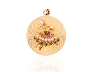 87 A 14K Gold and Gem-Set Charm Pendant Centering a ballerina motif set with cultured pearls, round rubies and sapphires, accented by a radiating gold motif  Measures: 1 1/2 in. 13.4 grams gross Estimate: $600 - $800