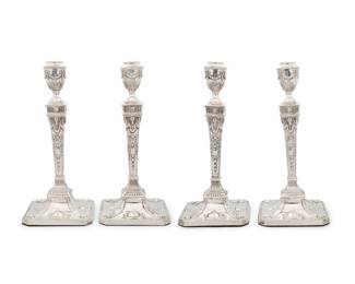 198 A set of four Neoclassical style weighted sterling silver candlesticks Martin, Hall & Co., London, 1890 With impressed standard, city, date letter, and maker's marks: RM / EH Each with repoussé laurel swags, bellflowers, urns, and ram's heads 4 pieces Each: 11.75" H x 5.25" W x 5.25" D Estimate: $400 - $600