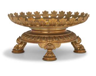 337 A Continental gilt bronze center bowl base 20th century With weighted base and egg and bellflower trim, raised on four paw feet 7" H x 14" Dia. Estimate: $700 - $900