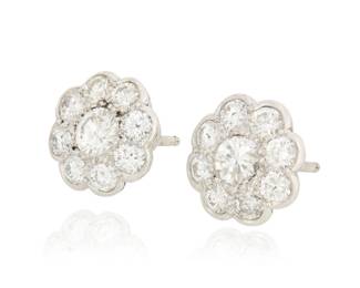 36 A Pair of Platinum and Diamond Stud Earrings Of a floral design featuring sixteen round diamonds weighing approximately 1.60 carats total 2 pieces  Measures: 3/8 in. 2.6 grams gross Estimate: $600 - $800
