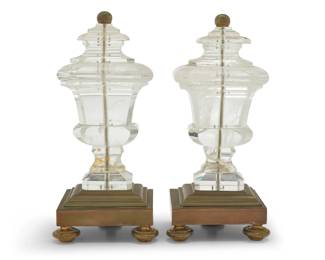251 A pair of rock crystal ornaments 20th century Each mounted on a brass tiered base with three feet 2 pieces Each: 10.875" H x 5" W x 4.125" D Estimate: $1,200 - $1,800