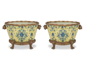 325 A pair of blue and yellow porcelain jardinières 21st century Each with blue underglaze maker's mark for United Wilson to underside Each with gold-toned metal mounts 2 pieces 11.25" H x 18" W x 12.25" D Estimate: $300 - $500