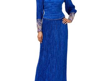 139 Mary McFadden: A Blue Pleated & Beaded Evening Gown Circa 1980s-1990s Label: Mary McFadden A long fitted dress in finely pleated blue fabric, featuring a fitted bodice with an elaborate beaded shaped neck panel and gauntlet style cuffs with zips, in blue, pink, white and gold beads and sequins, the bodice with tonal organza lining, large shoulder pads and net shapers, and the straight skirt with a ruffle seam to the dropped waist, with a side zip closure and a small zip to the neckline  Size 10: bust across front: 19 in.; waist: 14 in.; hips: 18 in.(at seam); sleeves: 26 in.; CB length: 60 in. Estimate: $200 - $400