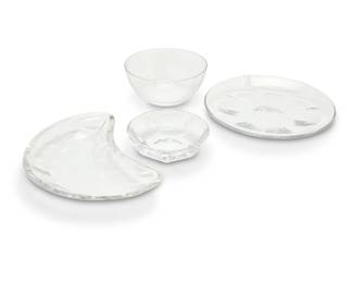 399 A group of Baccarat glass 'Harcourt' and 'Renaissance' bowls and plates Late 20th century Each with etched factory mark Harcourt: 14 crescent salad plates (8.125" W x 5.75" D) 14 salad plates (7.625") 7 finger bowls (5.125") Renaissance: 9 finger bowls (4.75") 44 pieces Estimate: $800 - $1,200