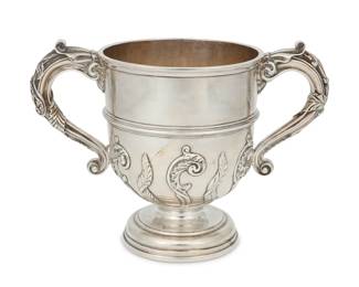 271 A Frank Smith Silver Co. sterling silver 'Chippendale' bowl Mid-20th century Marked for sterling, maker, pattern, and numbered: 196 With scalloped rim and lobed body, monogrammed at center 1.875" H x 9.625" Dia. 11.3 oz. troy approximately Estimate: $300 - $500