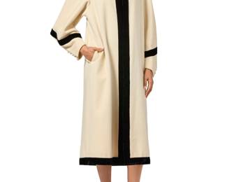 163 Emanuel Ungaro: A Two Tone Cream Wool & Black Velvet Coat Circa 1980s, Italy Label: Emanuel Ungaro / Couture / Paris A vintage felted cream/ivory wool mid-length coat with shaped sleeves and buttoned cuffs, trimmed in black velvet to the collar, edges and sleeves  No size label: CB length: 49 1/2 in.; across back at shoulders: 15 in.; sleeves: 26 in. Estimate: $100 - $200